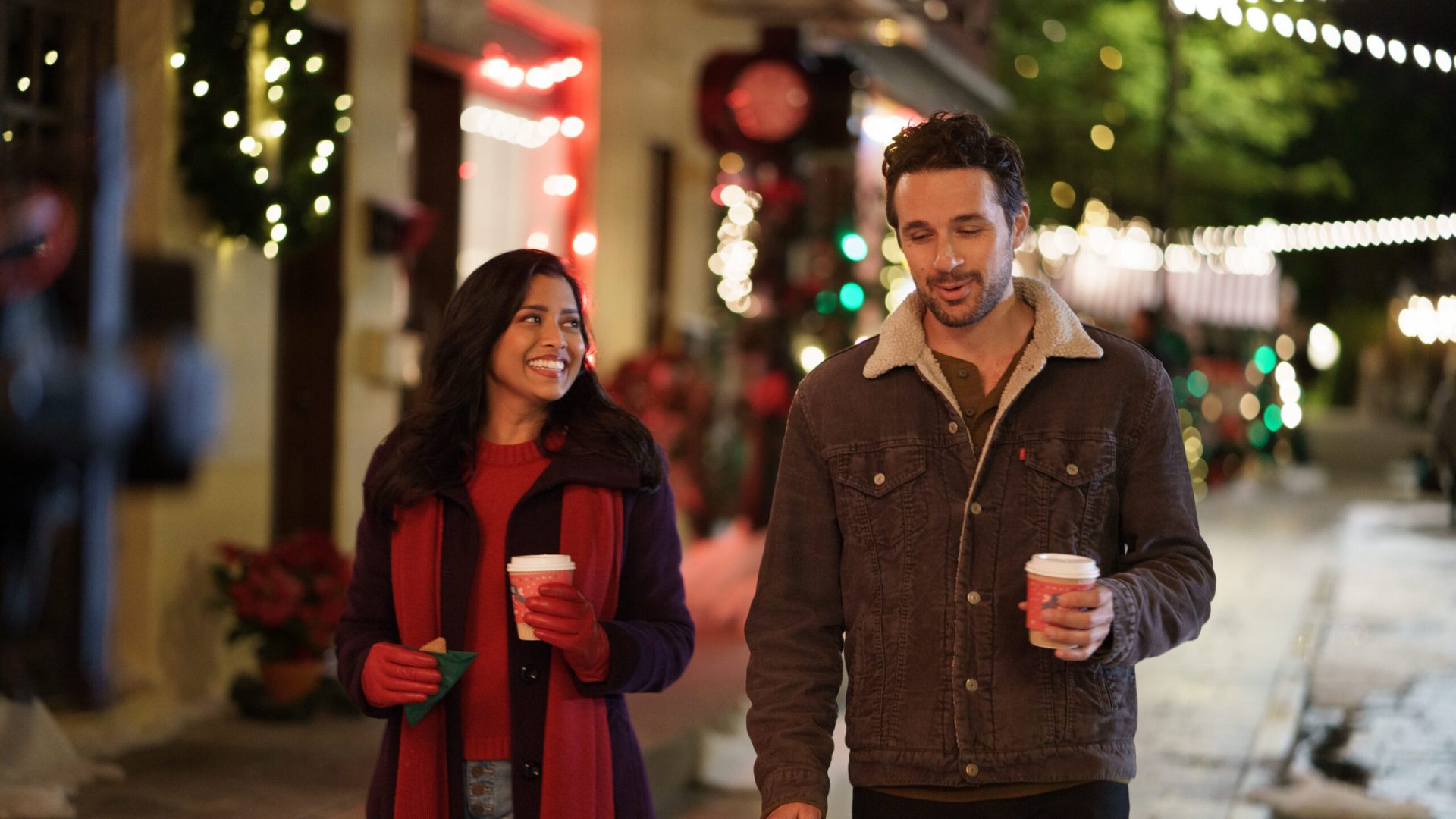 Tiya Sircar as Hazel Stanley and Marc Bendavid as James Meadows, as sen on A Gingerbread Christmas, Special.